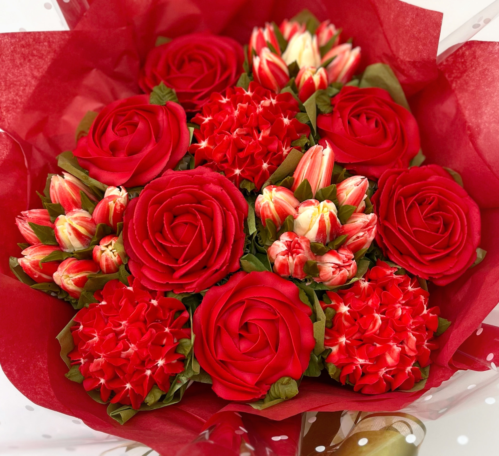 Classic 12-cupcake bouquet in red buttercream roses and tulips
