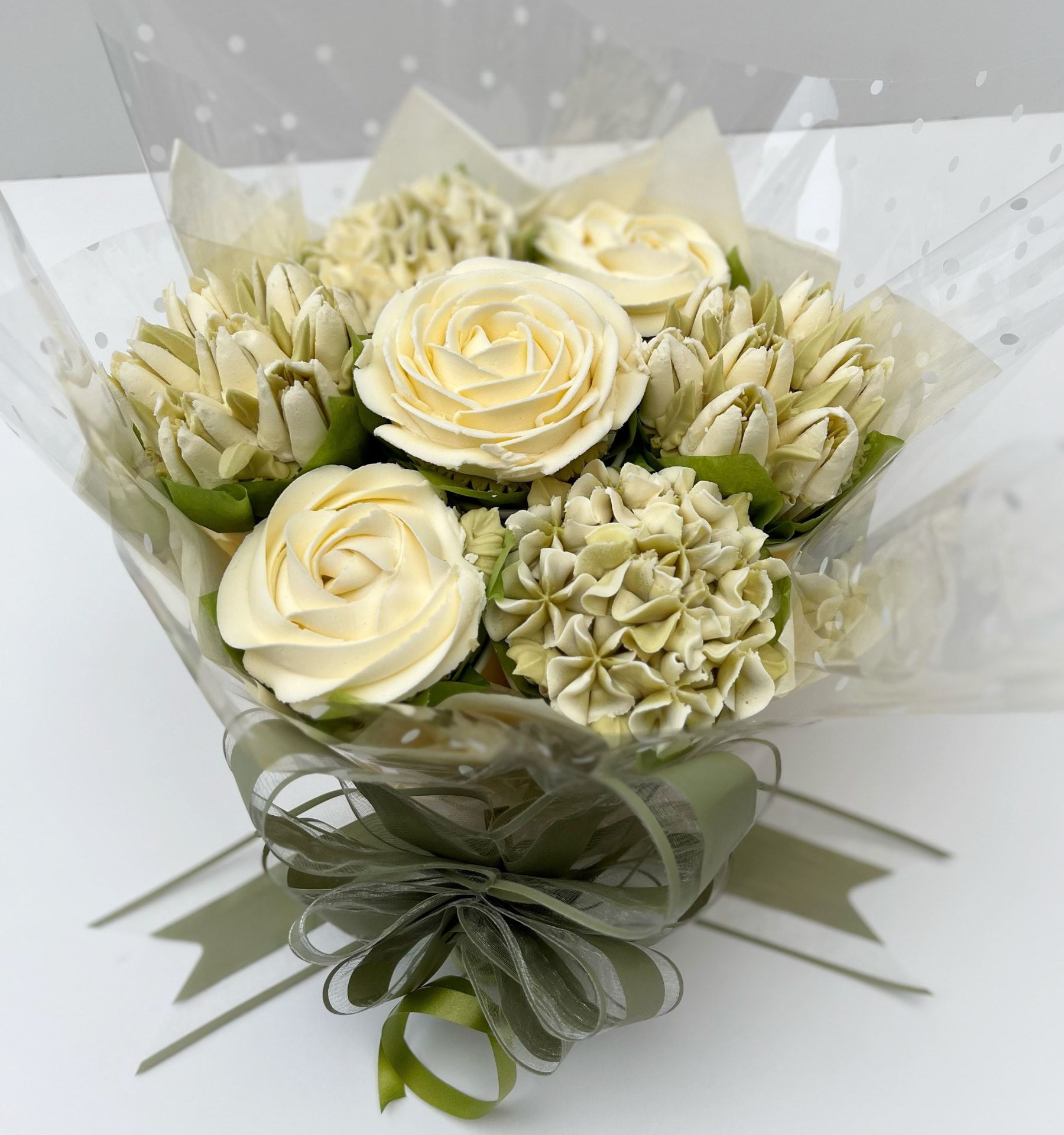 Classic 7-cupcake bouquet in white and green buttercream flowers