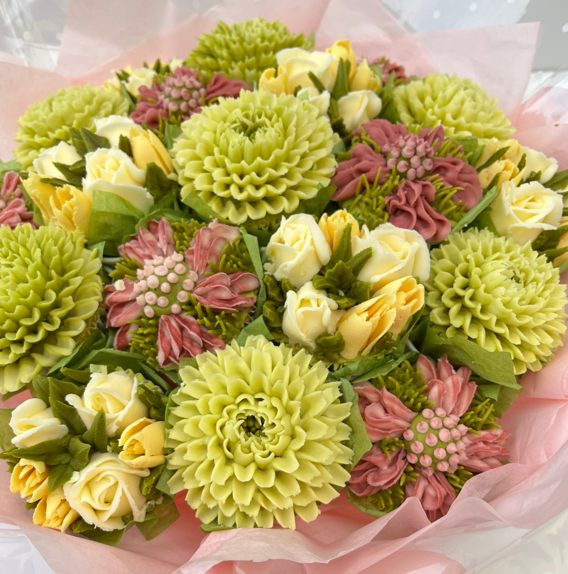 Luxury floral cupcake bouquet in dusky pink, green and lemon cream